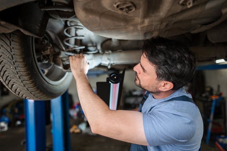 Under-vehicle inspection at Brothers Auto Care in Lubbock